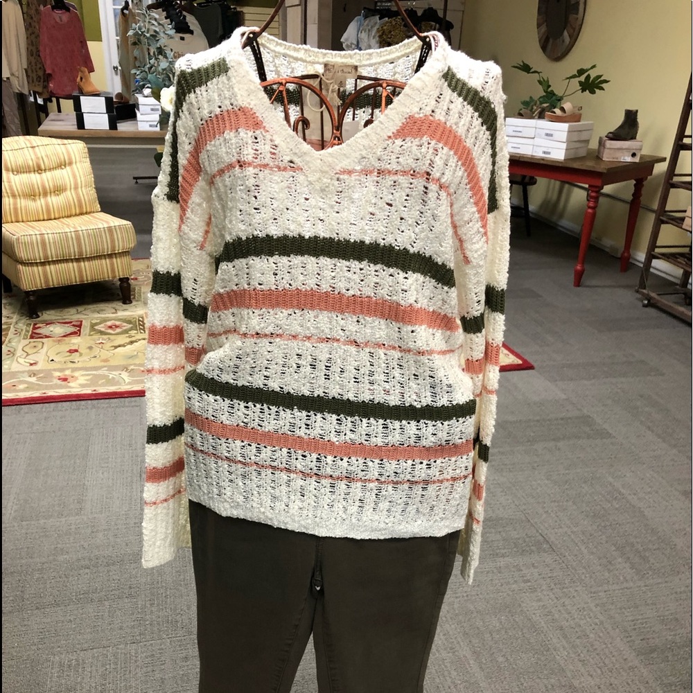 Lovely peach and mustard sweater.